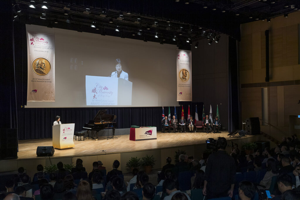 2018 ceremony at City University of Hong Kong, featuring speakers on stage